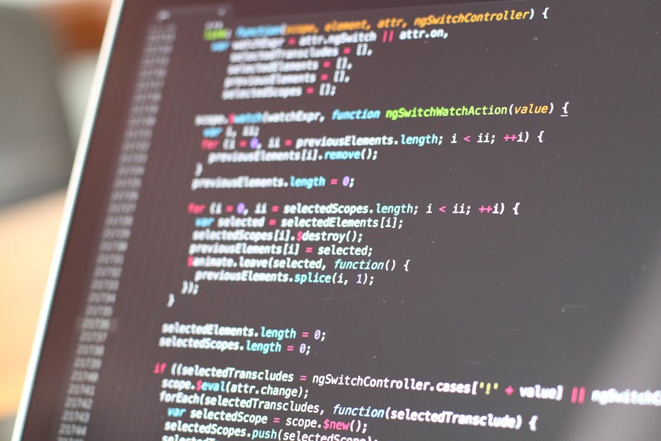 A computer screen displaying HTML code with lines of text in various colors, including tags such as <html>, <head>, <title>, and <link>, indicating the code of a webpage. The background is dark, and s